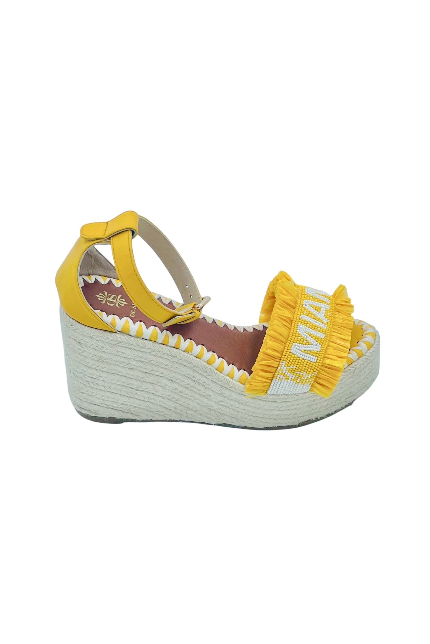 Miami Beaded Raffia Wedge - Yellow

Hello Summer! Enjoy these yellow beaded raffia wedge sandals in the city or during a stroll at the beach. A unique piece of handcrafted art.

upper: glass beads and raffia with lining in leather
adjustable leather ankle strap
wedge in juta, back height 8cm, front height 2cm
insole: leather with logo and hand stitched embroidery
hand crafted