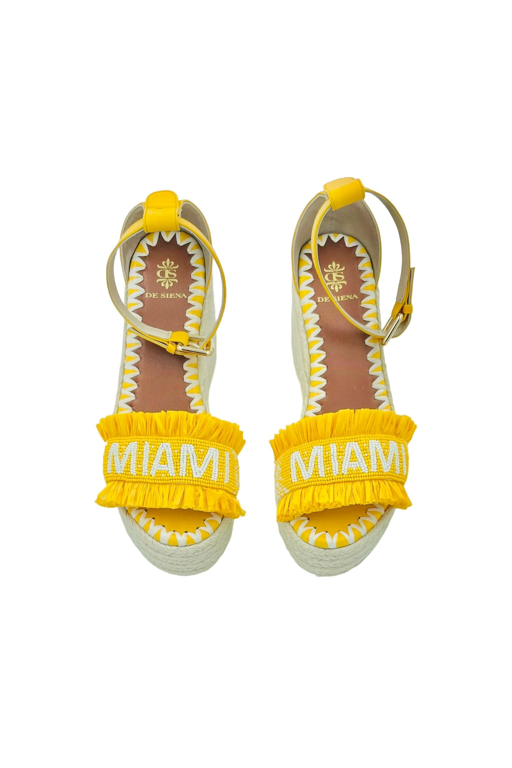 Miami Beaded Raffia Wedge - Yellow

Hello Summer! Enjoy these yellow beaded raffia wedge sandals in the city or during a stroll at the beach. A unique piece of handcrafted art.

upper: glass beads and raffia with lining in leather
adjustable leather ankle strap
wedge in juta, back height 8cm, front height 2cm
insole: leather with logo and hand stitched embroidery
hand crafted