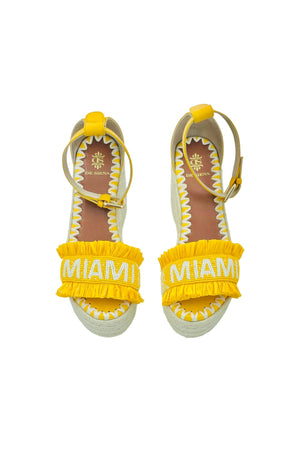 Miami Beaded Raffia Wedge - Yellow

Hello Summer! Enjoy these yellow beaded raffia wedge sandals in the city or during a stroll at the beach. A unique piece of handcrafted art.

upper: glass beads and raffia with lining in leather
adjustable leather ankle strap
wedge in juta, back height 8cm, front height 2cm
insole: leather with logo and hand stitched embroidery
hand crafted