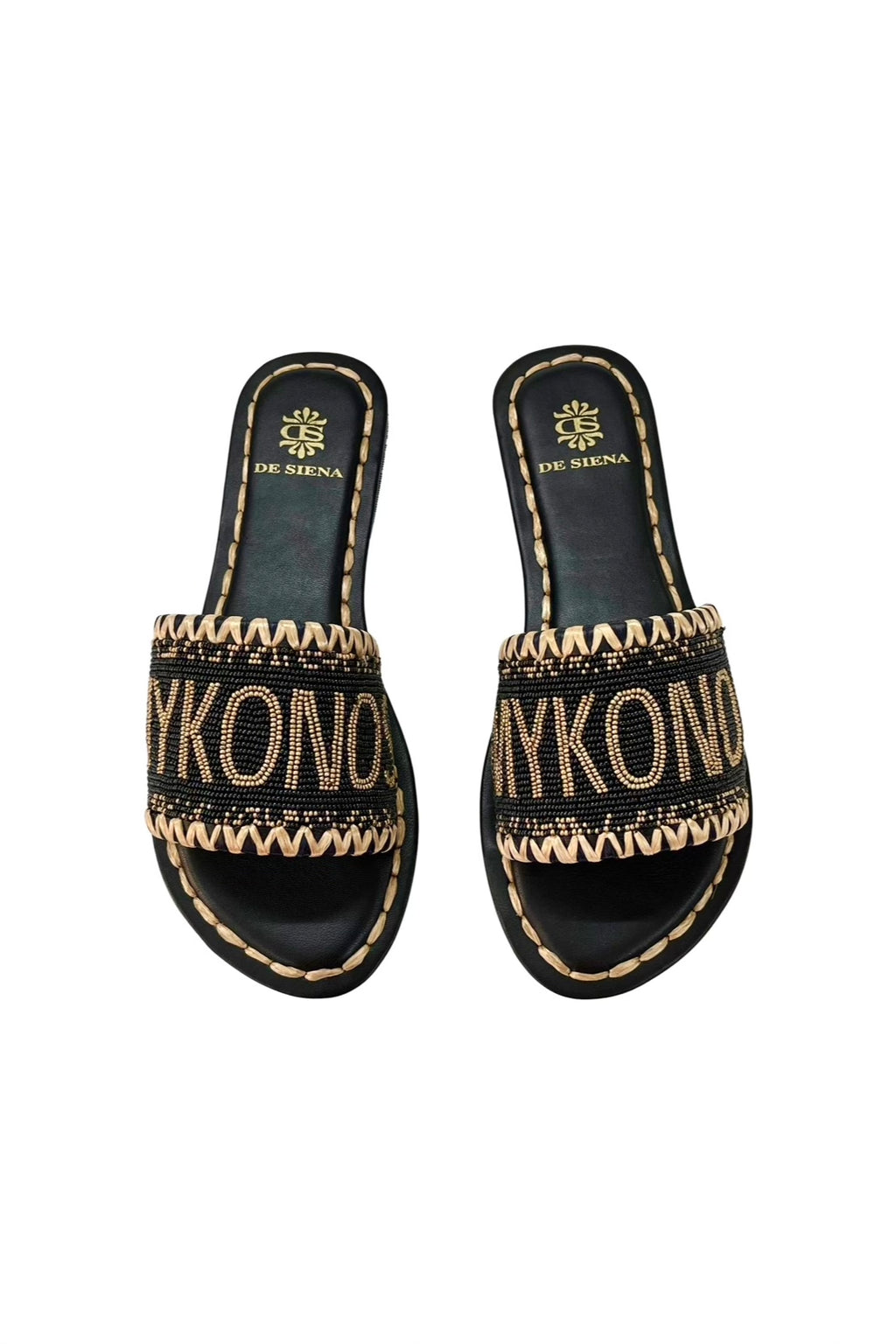 Mykonos Beaded Dégradé Resort Slides - Black/Gold, by De Siena

Welcome to Mykonos You'll catch us wearing these flat sandals during our vacation in Mykonos, heading to the beach for a sunset party. Hand crafted with dozens of little beads and embroidered sole, these flats in red are the best companions for a fun night out.