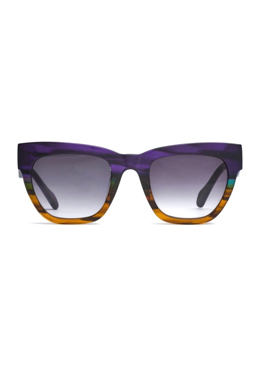 Savage - Purple, by Age Eyewear SAVAGE adjective. Fiece, ferocious, untamed.  Like the opal itself, this purple frame is semi-transparent and showing many small points of shifting colour against a pale or dark ground.  This large frame with is sleek curves and angular temples allows you to throw caution to the wind and getting back to primitive form.
