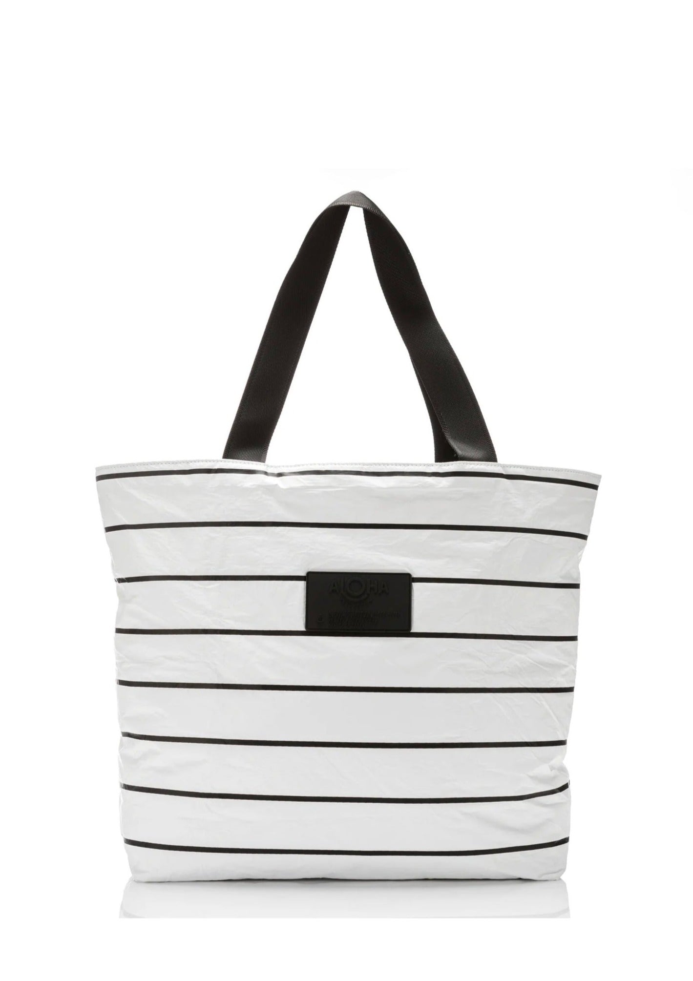 Aloha Day Tripper Tote - Pinstripe Black/White Our classic and best-selling Pinstripes are ready for take off with our Day Tripper Tote! These timeless stripes pair perfectly with any adventure!