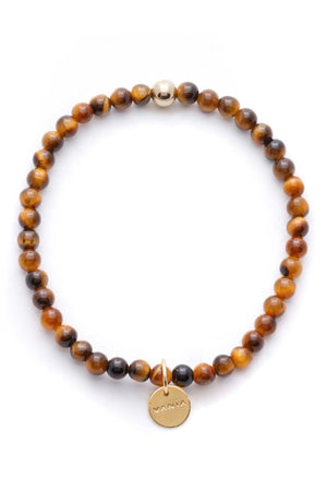 Mens Amuleto Tiger's Eye Bracelet, Gold Filled, by VANIA

Said to be the stone that heals issues of self-worth, self-criticism and blocked creativity, by wearing this piece be reminded of your abilities and talents. Sometimes it’s easy to focus on what we need to fix, in that let’s not forget to pause and celebrate. Let’s not forget why we do what we do. This Tiger's Eye Bracelet is your constant reminder to do what you love and love what you do.