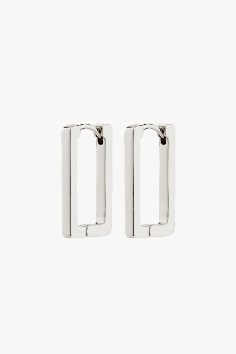 Feel Recycled Earrings - Silver Plated, by Pilgrim

Feel the joy of living each day and let the FEEL earrings from Pilgrim add an urban Scandi touch to your look. Silver-plated square hoops in a rectangular design for a sharp and stylish look. A true evergreen in your jewellery collection, perfect for a minimalist, cool vibe. With easy-to-use click clasp, they're perfect for a life-on-the-go lifestyle - ready to add an extra touch of classiness to your day. And guess what - they are made from 99% recycled m