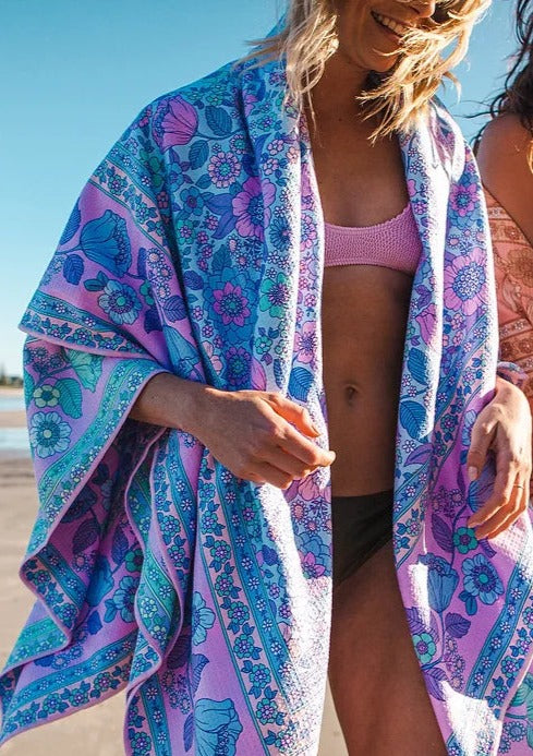 XL Reversible Eco Beach Towel/Picnic Blanket  - Pastel Bloom Blue/Mint, by Flock These stunning and soft beach towels are made from 85% post-consumer plastic bottles. Recycled plastic bottles are transformed into polyester fabric to be used to create these amazing towels. It takes up to 22 plastic bottles to make one towel, ultimately preventing these plastic bottles from ending up in landfills or our oceans.  Full reversible - Pastel Bloom Blue / Pastel Bloom Mint