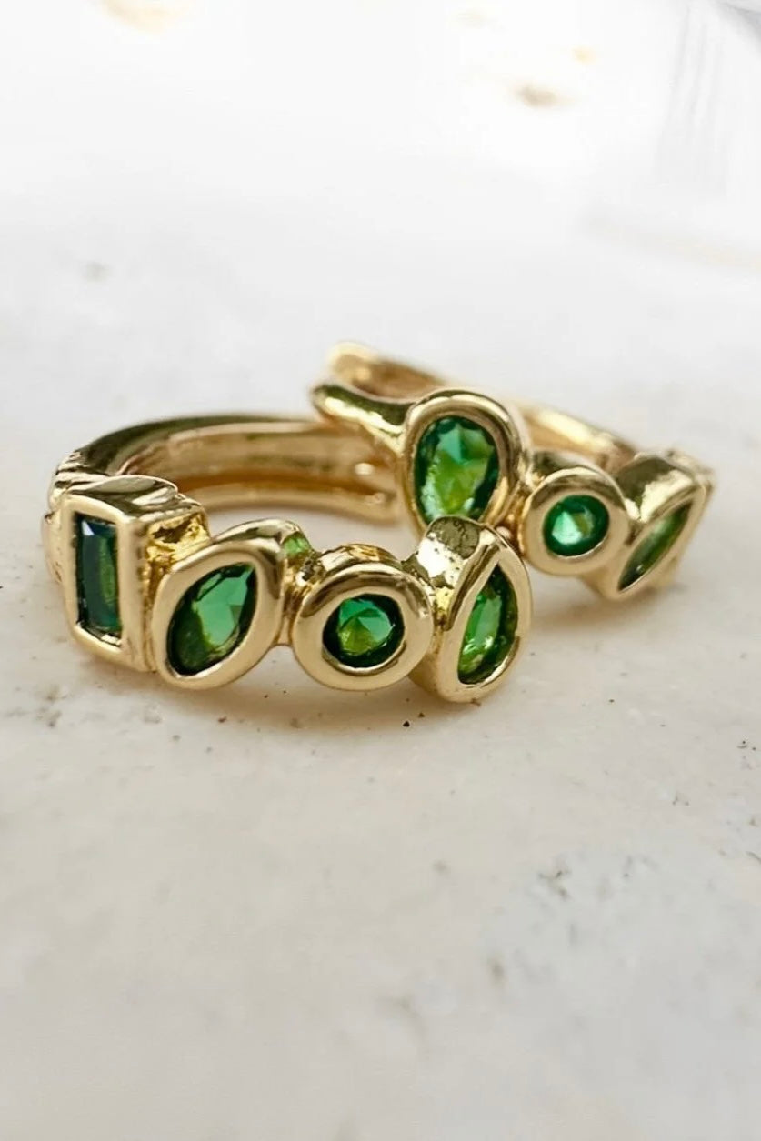 Glory Huggie Earrings - Emerald/Gold, by Ever

Sweat Resistant. Waterproof. Anti-Tanish. No Fade. Hyperallergenic.

Our vibrant new Glory Huggie Earrings are designed to add a touch of colour and charm to your style.&nbsp;

Featuring a stunning array of Emerald stones set in sleek gold plating, these hoops are the perfect pop of colour for your everyday look.&nbsp;