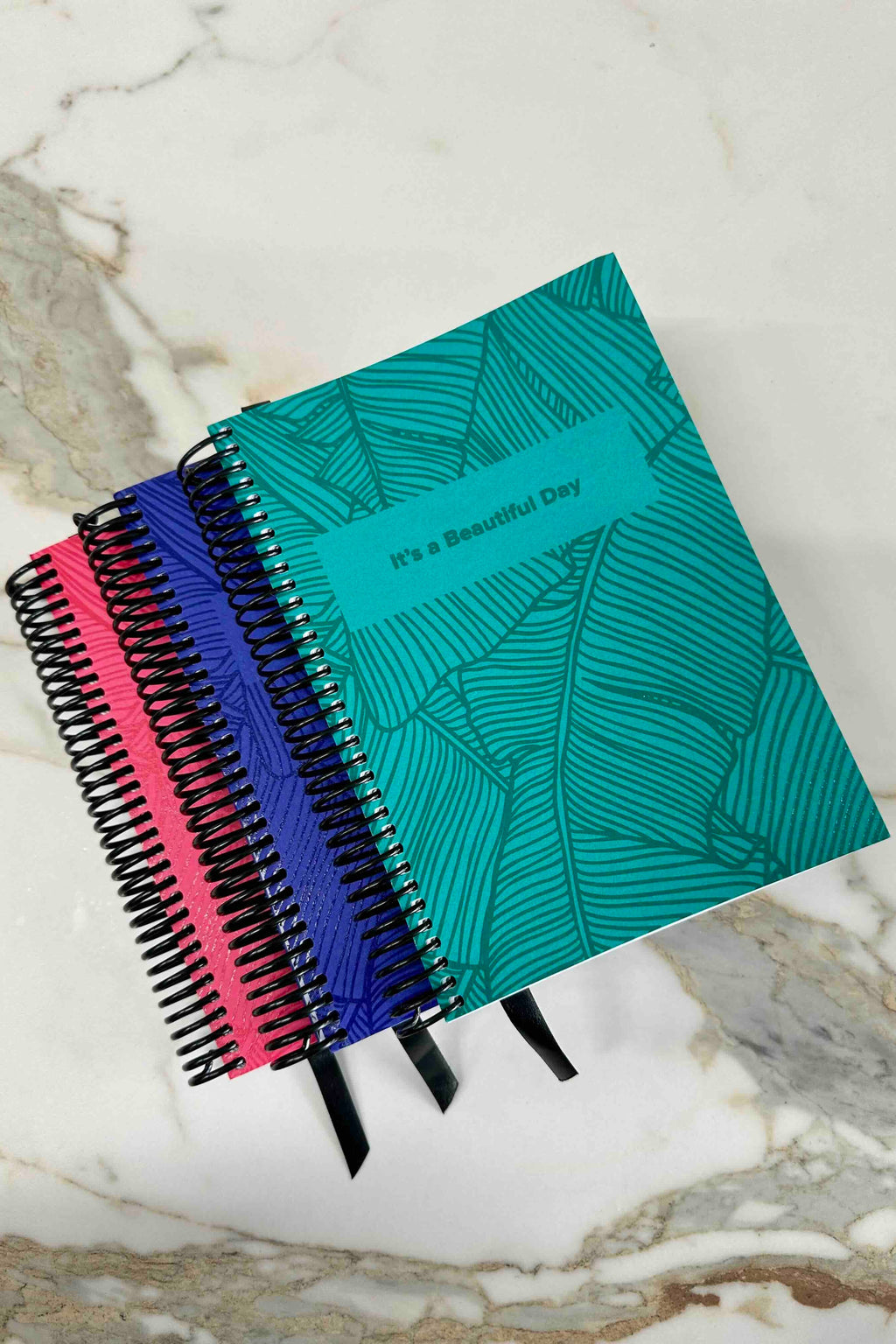 "It's a Beautiful Day" Planner, by Claire Turnbull

These beautifully designed planners have been crafted with care to help you feel good and get the best from each and every day. It will help you to create a healthy, balanced life by providing the structure, support and motivation you need to reach your goals and create new healthy habits that last. The purpose of this planner is to help you focus on the things that really matter, because quite honestly, life can be complicated enough.