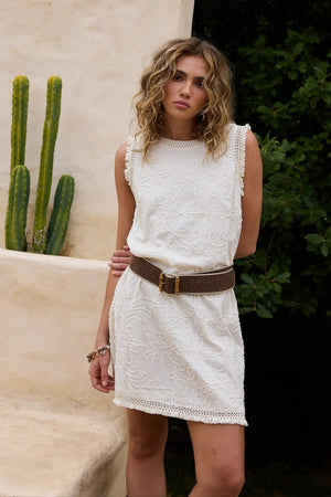 Chantilly Dress - Natural Embroidery, by Talisman
Sleeveless

Round neckline
Lace fringe trim detail along armhole and hem

A-line silhouette

Centre back zip fastening

Mini length

Embroidered cotton fabrication