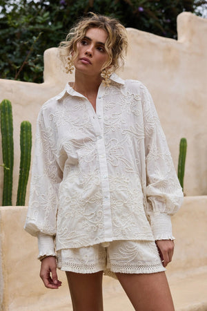 Chantilly Shirt - Natural Embroidery, by Talisman
Button up front

Oversized fit

Exaggerated grown on sleeves

Shirred cuffs

High low hem

Beautiful embroidered seersucker fabrication