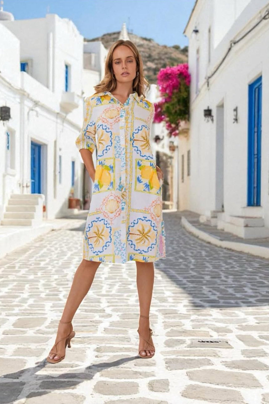 Shirtmaker Dress - Amalfi Dreams, by Kaleido

This 100% linen shirt dress by Kaleido is a summer party classic. With its collared neck, button down front and three quarter sleeves, you'll be the life of the party.

Features:

Collared Neckline
Button Through Front
Pockets
Curved Hemline