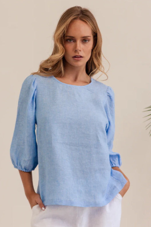 Linen 3/4 Sleeve Top - Chambray, by Kaleido

Designed for comfort and effortless elegance, the Linen Elbow Sleeve Top by Australian Label Kaleido is made from premium linen offering easy comfort and breathability, great for staying cool and stylish on warmer days.&nbsp;Featuring a flattering high round neckline and puffed 3/4 elasticated sleeves, this beautiful top&nbsp;can be kept casual or elevated with smart pants for going out.