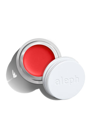 Aleph Cheek / Lip Tint: Gloria

5g / .17 oz

The perfect energetic orangey red. An Aleph X Kate Sylvester Collaboration to mark the launch of the AW24 collection Gloria Gloria. Blend, buff, layer, or mix. Clean and sustainable makeup with maximum versatility and skincare benefits. Limited Edition.