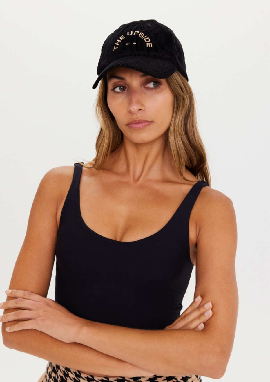 Corduroy Soft Cap - Black, by The Upside For a sophisticated take on sun smarts, discover our Corduroy Soft Cap.  Soft retro fit cap 'THE UPSIDE' embroidered preppy logo at front Adjustable velcro strap at back Soft corduroy fabrication in classic black