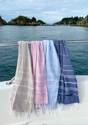 Zipper Pocket Turkish Towel, by Treat & Co Introducing Treat & Co's own NZ original Zipper Pocket Turkish towels. It is super light weight, ideal for taking to the beach or on holiday.  Available in 4 colours! Baby Blue, Navy, Beige & Baby Pink. 