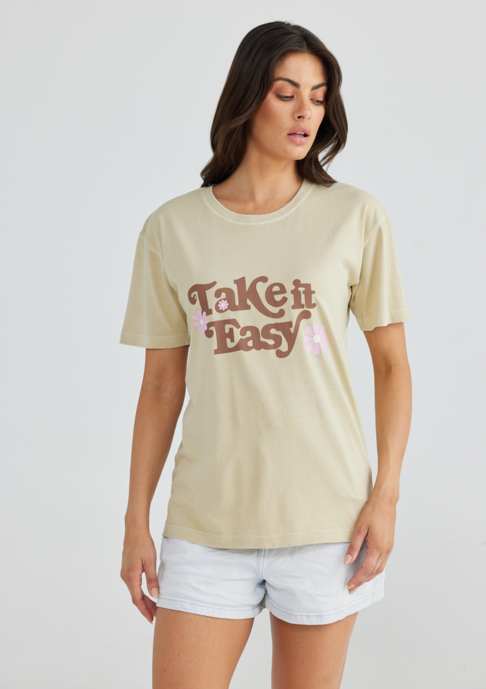 Take it Easy Relaxed Tee - Ecru, by Talisman An essential tee to add to your collection of sustainable staples. Woven from soft organic cotton, this Talisman treasure features beautiful in-house designed artwork. With a wide neck binding and elongated sleeves that tap into its oversized fit, this versatile piece is great for layering, tucking or tying, and looks just as gorgeous worn loose.
