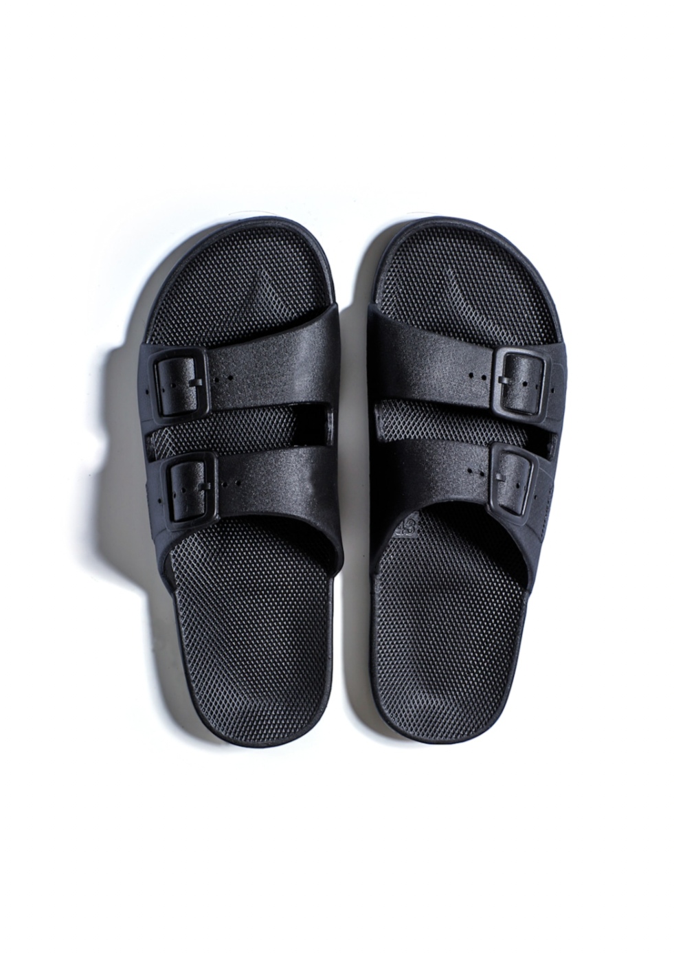 Freedom Moses 'Black' - Womens + Mens Slides We kept only the essentials, for the ultimate comfort.  Our slides are flexible, yet supportive.  Designed to feel like a hug for your feet