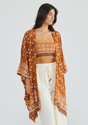 Luna Cape - Rada Spice, by Talisman The Luna Cape is a one-sized wonder that'll make spring layering an absolute breeze. Throw it over your fave denim and a distressed tee for a bohemian grunge attitude, or team it with a Bandeau and pants for luxe lounge vibes