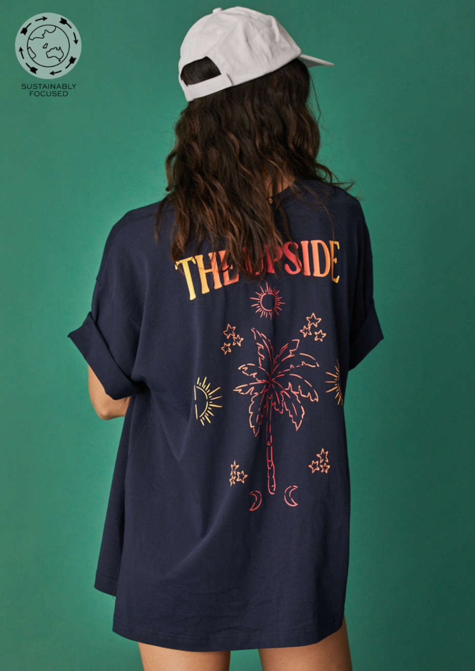 Magic Laura Tee - Indigo, by The Upside Be your own muse in our Magic Laura Tee.  Made with 100% Organic Cotton jersey Printed ombre logo at front chest Placement printed ombre palm artwork at back Rib neckline