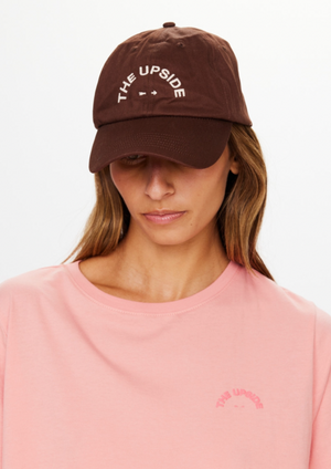 Soft Cap - Chocolate, by The Upside Protect yourself with the cruisy polish of our Soft Cap.  Soft retro fit cap 'THE UPSIDE' embroidered horseshoe logo at front Adjustable velcro strap at back Organic cotton twill fabric in chocolate