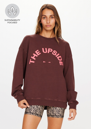 Saturn Crew - Chocolate, by The Upside Out of this world comfort is always in style - see for yourself with our Saturn Crew.  Organic Cotton loopback in chocolate brown Relaxed and oversized crew Pink printed horseshoe logo at front chest Ribbed cuff and neck line