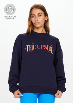 Magic Saturn Crew - Indigo, by The Upside A stellar take on a wardrobe essential, try our Magic Saturn Crew.  Relaxed and oversized crew Organic Cotton french terry in navy Printed ombre logo at front Ribbed cuff and neck line