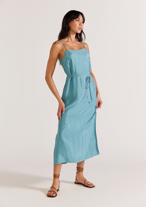 Nola Cupro Slip Dress - Duck Egg Blue, by Staple The Label Silky duck egg blue slip dress. - Straight neckline with thin adjustable straps and double button closure in back. - Thin removable waist tie with beaded detailing - Side split in hem.