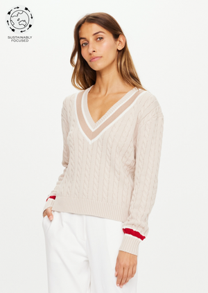 Trophy Sonny Knit Sweater - Malt, by The Upside Straight from the trophy room, dive into our Sonny knit sweater.  Classic V neck knit in organic cotton in natural malt colour Knitted stripes at sleeve hem and neck A pop of red at the cuffs Please refer to studio images for accurate colour of garment