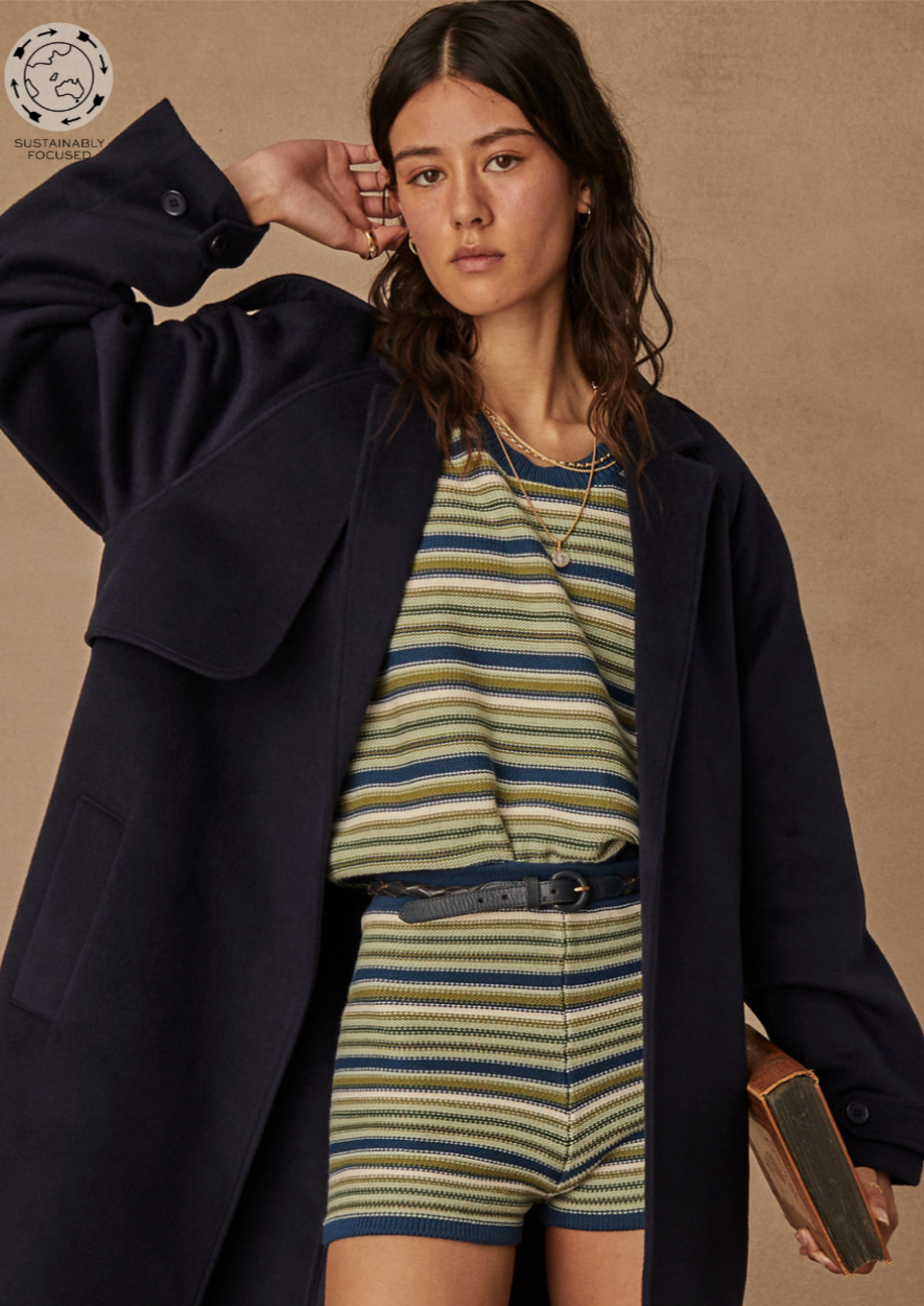 Porto Lucca Sweater - Stripe, by The Upside Beat the chill in this retro stripe knit sweater. Organic cotton stripe knitted sweater in hues of green Soft rib neck and sleeve cuffs Embroidered arrow logo at back Please refer to studio images for accurate colour of garment