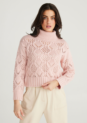<h3><span>Rosie Knit - Musk, by Talisman</span></h3> <p><span>ROLL NECK</span><br><span>DROPPED SHOULDER</span><br><span>LONG SLEEVE</span><br><span>REGULAR, CROPPED FIT</span><br><span>OPEN WEAVE CABLE DESIGN</span><br><span>RIBBED NECK, CUFFS &amp; HEM</span><br><span>SLEEVE BUTTON FEATURE</span></p>