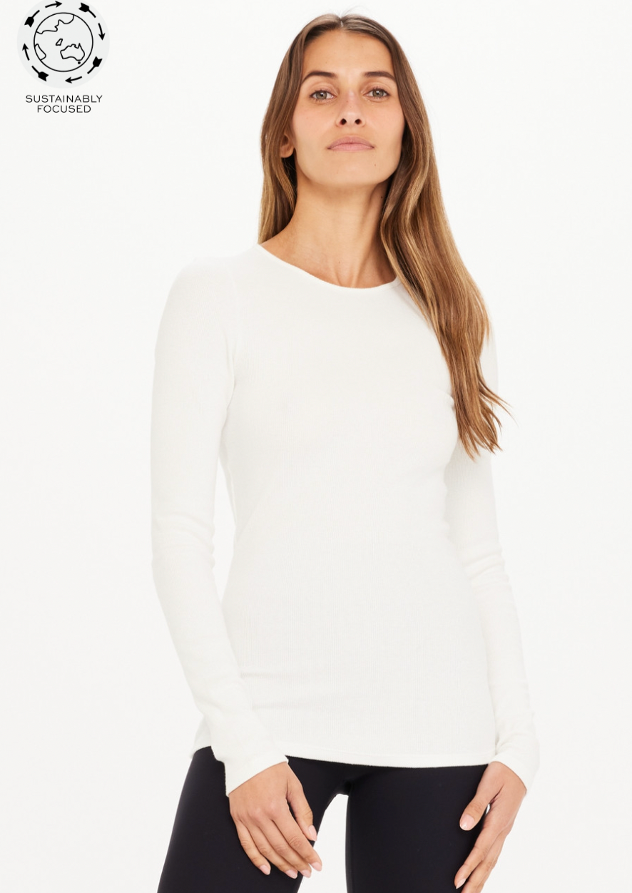 <h3 data-mce-fragment="1"><strong data-mce-fragment="1">Chrissy Long Sleeve - White, by The Upside</strong></h3> <p><strong>For a layer you will love, try our Chrissy Long Sleeve Top..</strong></p> <ul> <li>Ribbed long sleeve top</li> <li>Slim fitting, ribbed fabrication</li> <li>Organic cotton elastane rib for everyday luxe</li> <li>Embroidered tonal arrow logo</li> </ul>