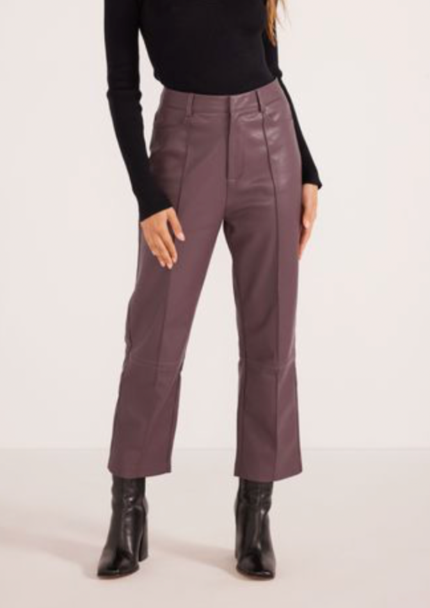 <h3><span>Yelena Faux Leather Pants - Grape, by MinkPink</span></h3> <p><strong>Details:</strong></p> <p><span>The Yelena PU Pants aren't just your average faux leather pants. Step out in style and make a statement that will have you elevating your everyday look to the next level of stylish. Style with a basic ribbed top and some petite heels to complete the look.</span><br><span>- Pin-tuck front</span><br><span>- Ankle grazer</span><br><span>- PU faux leather</span></p>