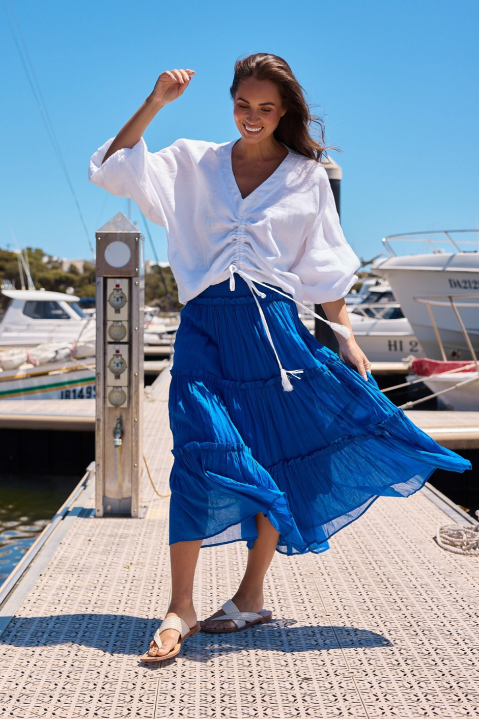 Pier Skirt - Sapphire, by Holiday  Details:  Versatile styling options - wear as a skirt or a dress!  Shirred waist panel  Tiered skirt design with ruffle trim