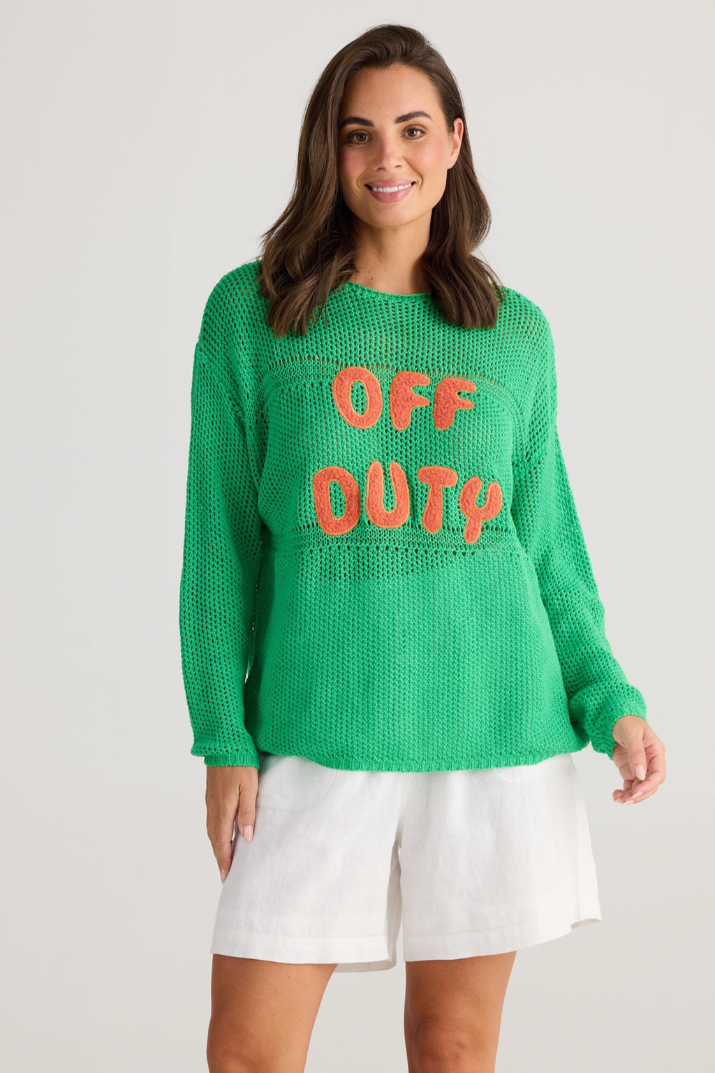 Off Duty Knit - Green, by Holiday  Details  Crochet design  Round neckline  Drop shoulder  Hip length  Featured fleece applique text "OFF DUTY"