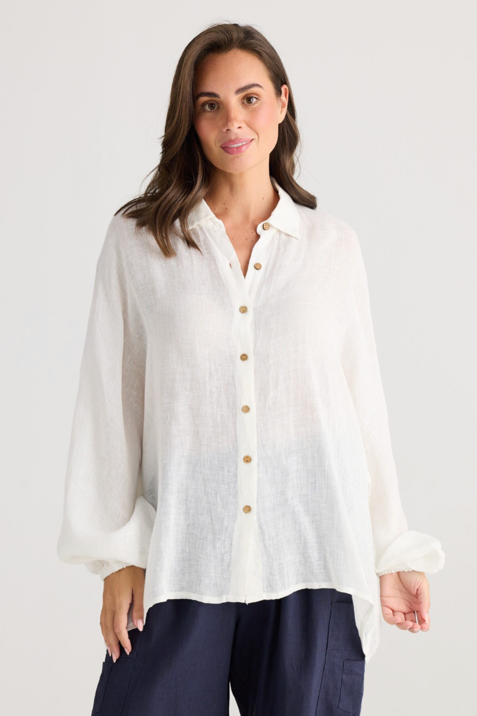 Cliffside Shirt - White Linen Gauze, by Holiday

Details:

Button up front

Oversized fit

Exaggerated grown on sleeves

Button up cuffs

High low hem