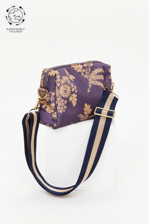 Fleur Cosmic Crossbody Bag - Floral, by The Upside

A compact carry all for all your necessities.

Recycled Polyester crossbody bag printed in our Fleur print
Fully insulated and lined with internal pocket
Chunky zipper with paracord ends
Adjustable stripe navy and tan strap
Tonal rubber logo patch
