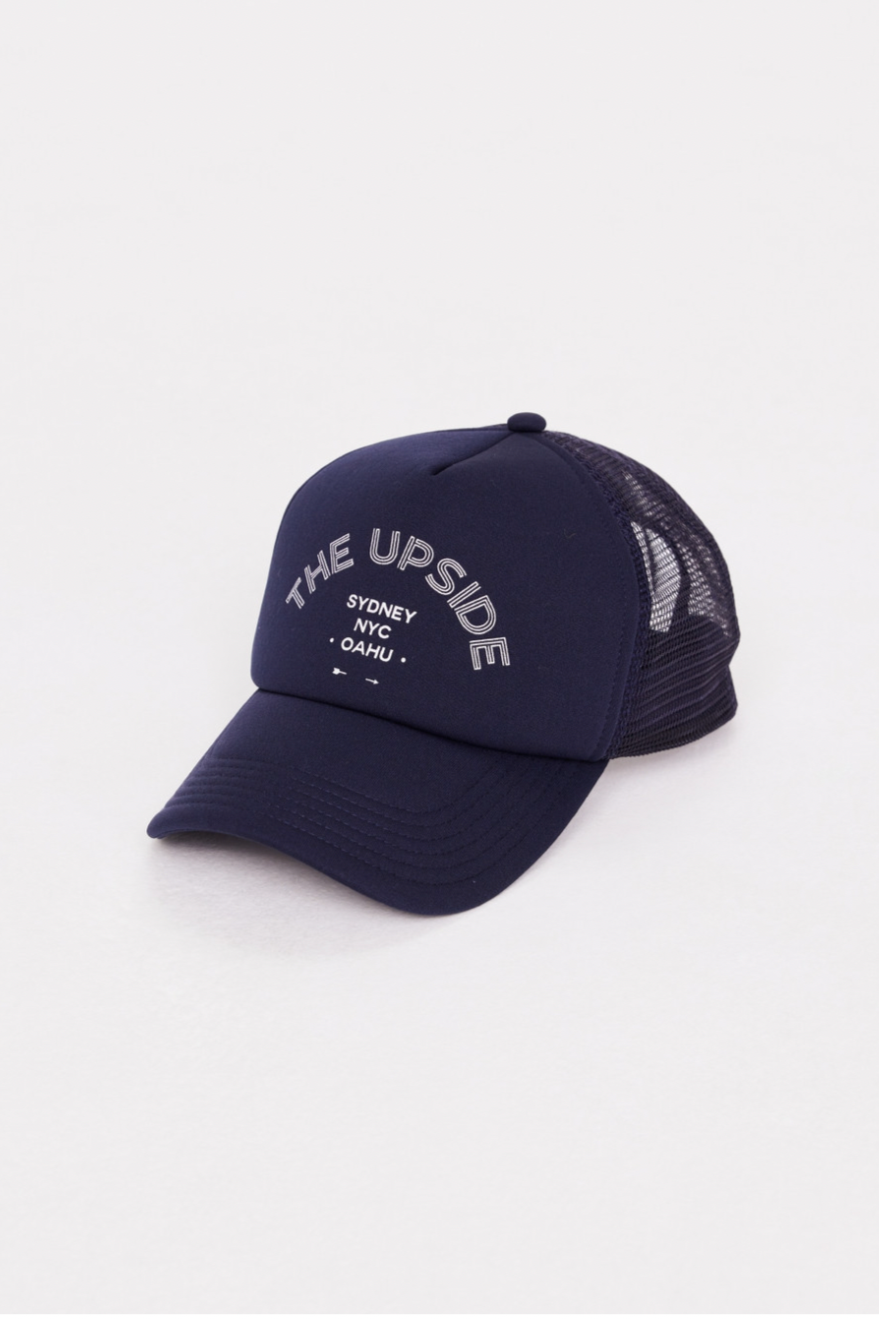 Jetset Trucker Hat - Navy, by The Upside

The trucker cap is back and better than ever!

Classic trucker in navy with foam front and mesh back
Adjustable snapper at back
Printed logo at centre front
We pay homage to some of our favourite cities we like to call home, Sydney, New York City and Oahu
