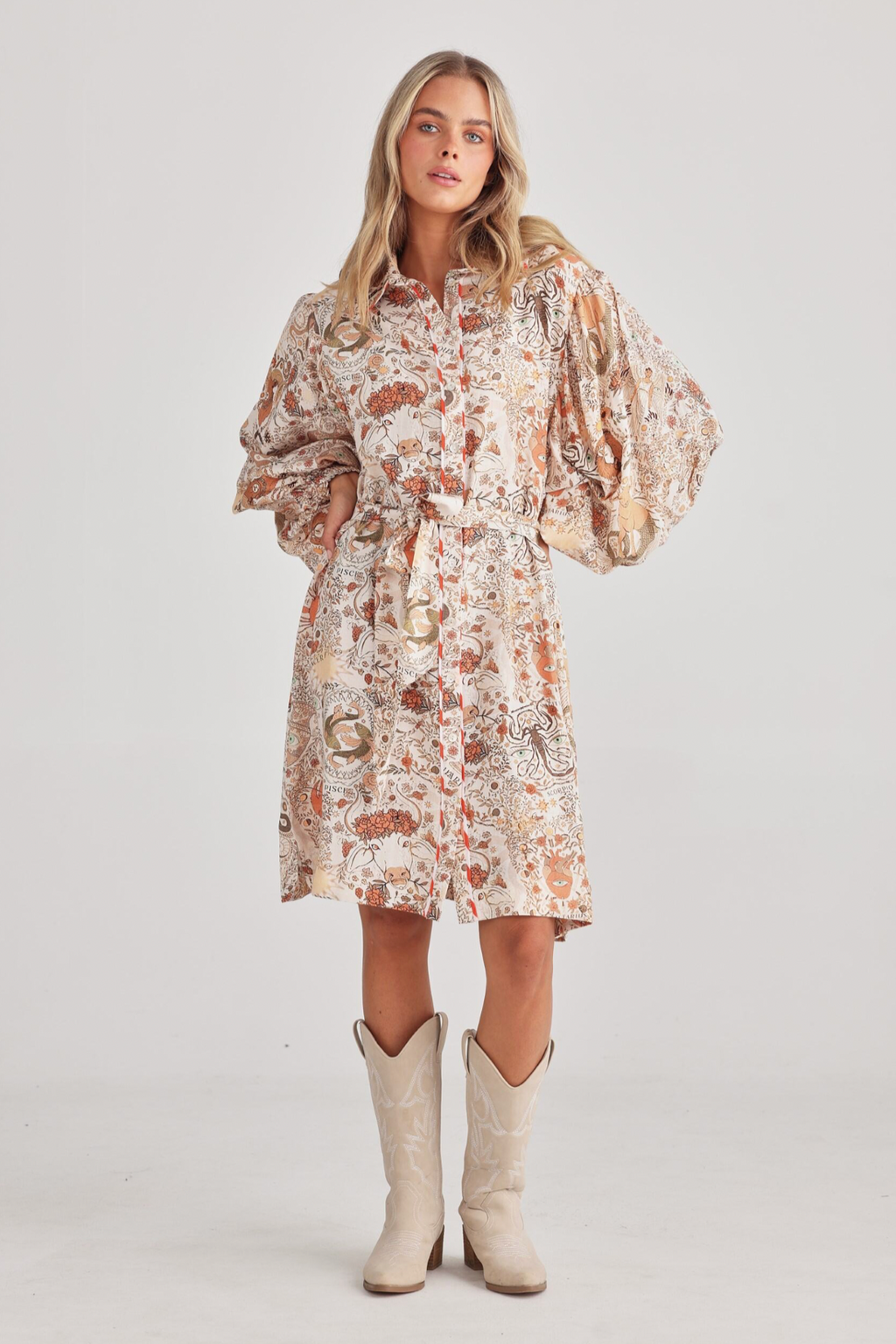 Annabelle Dress - Zodiac, by Talisman
Classic shirt collar with button through front

Dropped armhole

Billowy peasant sleeve into a shirred cuff

Waist tie

Knee length