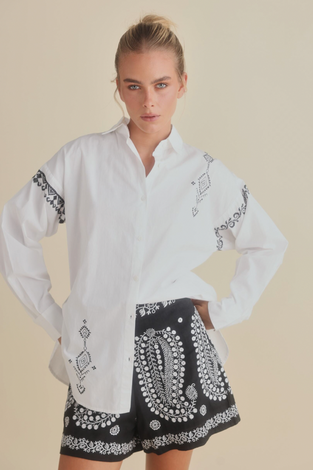 Flamenco Shirt - White with Black, by Talisman
Classic shirt collar with button through front

Oversized fit

Curved hem

Stunning feature embroidery