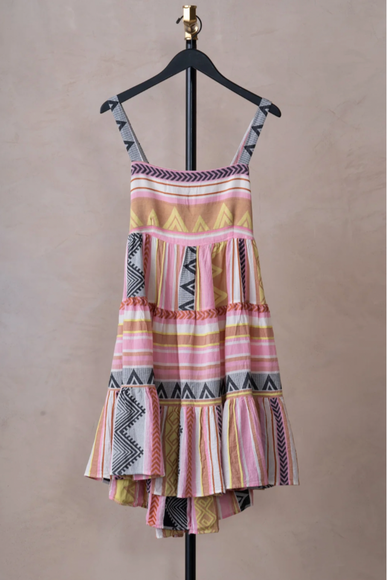 Devotion Athina Dress - Multi Pink

From Devotion Twins, this short loose Athina dress is perfect for hot days.&nbsp;Cut from 100% cotton for a lightweight and breathable feel, this chic summer dress features distinctive yellow, pink and black&nbsp;embroidery throughout. Cut for a relaxed fit through the body, the dress boasts a three tiered skirt. Pack this beauty in your suitcase for your next holiday and team with your favourite sandals while exploring the city.