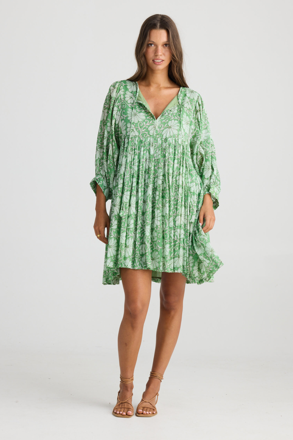 Wisteria Mini Dress - Apple Blossom, by Talisman
Round neck

Relaxed fit

Neck ties

Gathered 3/4 sleeve into a cuff

Mini length