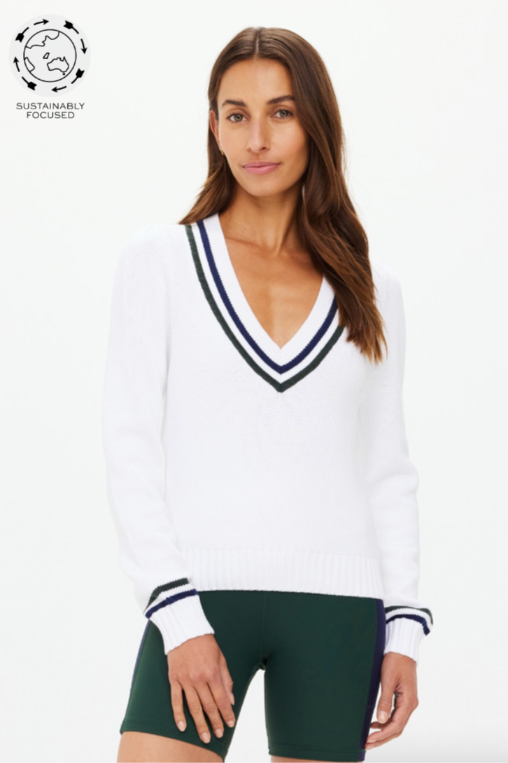 Sonny V Neck Knit Sweater - White, by The Upside

Straight from the trophy room, dive into our Sonny knit sweater.

Classic V neck knit in organic cotton in white
Knitted stripes at sleeve hem and neck in navy and green
Embroidered arrow logo at back neck
Please refer to studio images for accurate colour of garment