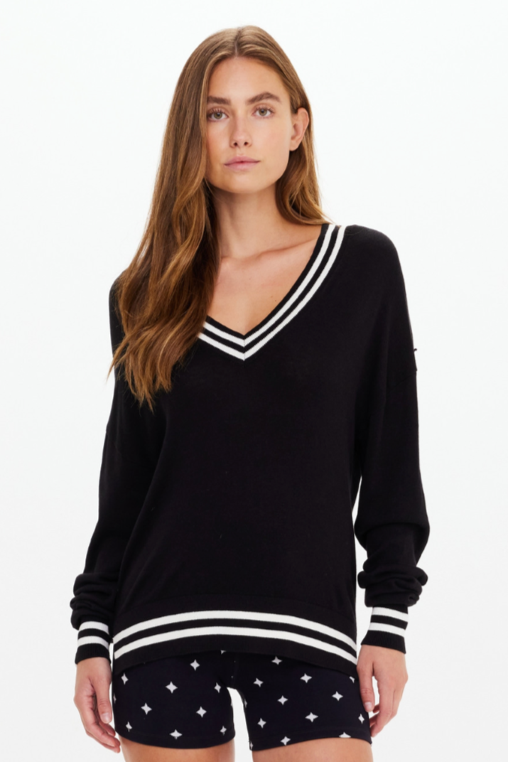 Duet V Neck Knit Sweater - Black, by The Upside

A timeless black knit for every moment

Lightweight V neck sweater
Relaxed drapey shape
Black with cream stripes
Splits at side seams
Arrow logo pip at sleeve edge
Please refer to studio images for accurate colour of garment