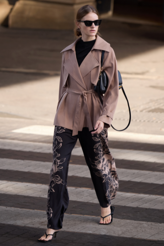 Mira Drawstring Pant - Floral, by Staple The Label

The Mira Drawstring Pant brings relaxed tailoring and statement print together. With a wide leg silhouette and floral border detailing, these lightweight pants are made for elevated off-duty days.