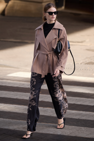 Mira Drawstring Pant - Floral, by Staple The Label

The Mira Drawstring Pant brings relaxed tailoring and statement print together. With a wide leg silhouette and floral border detailing, these lightweight pants are made for elevated off-duty days.