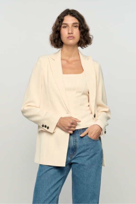 Sia Blazer - Cream, by Staple The Label

The Sia Blazer is a modern take on effortless tailoring. Crafted from a lightweight ramie-cotton blend, it features a relaxed fit with structured shoulders, classic lapels and a single vent at the back for easy movement. The soft ivory tone pairs perfectly with denim.