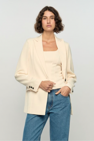 Sia Blazer - Cream, by Staple The Label

The Sia Blazer is a modern take on effortless tailoring. Crafted from a lightweight ramie-cotton blend, it features a relaxed fit with structured shoulders, classic lapels and a single vent at the back for easy movement. The soft ivory tone pairs perfectly with denim.
