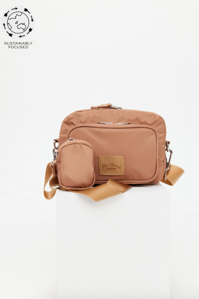 Odyssey Crossbody Bag - Tan, by The Upside

Seek out new horizons with our always handy Odyssey Crossbody Bag

Recycled polyester crossbody bag in shades of tan
Adjustable and removable strap
Removable mini pouch at strap
Multi pockets with zippers and silver hardware
Logo badge at front
Please refer to studio images for accurate colour of garment