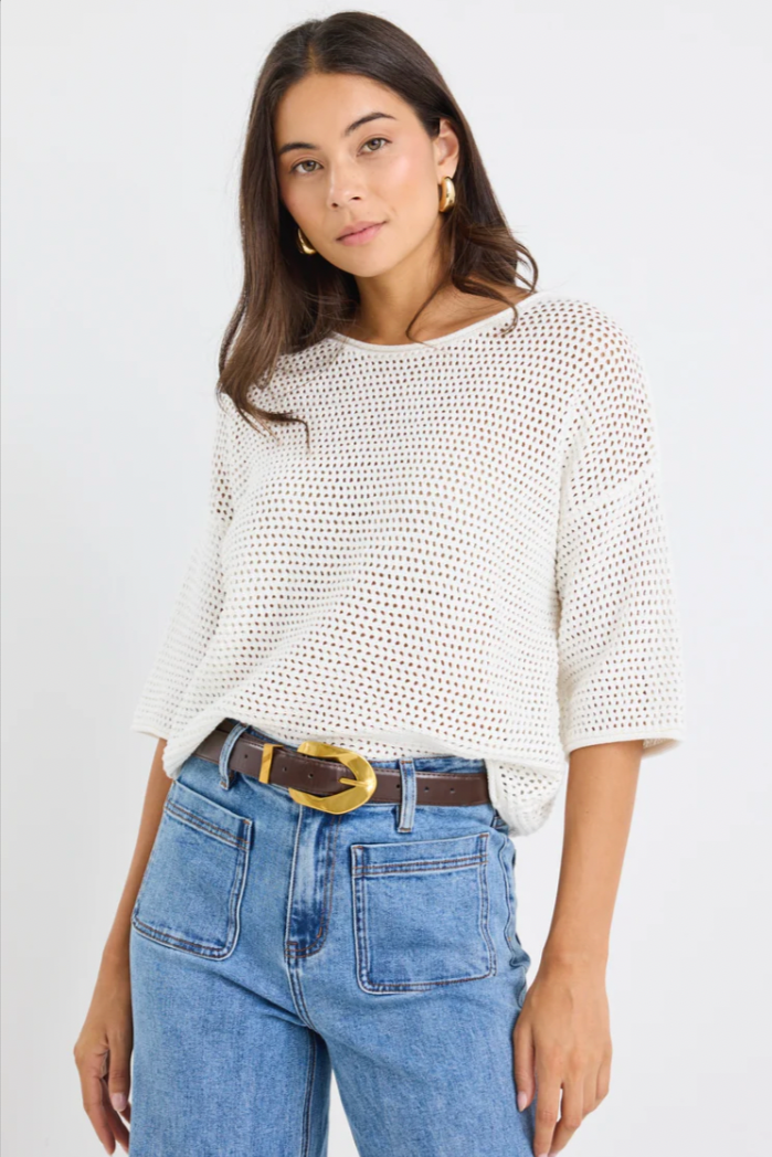 Sunrise Crochet Knit Tee - Ivory, by Re:Union Label

Easygoing yet elevated, the Sunrise cotton knit tee is your new off-duty go-to. With a breezy open weave and relaxed fit, it brings effortless texture and breathability to your everyday style perfect for layering or wearing solo.

This tee strikes the perfect balance between casual and cool, making it ideal for high-low dressing with tailored trousers or relaxed denim.