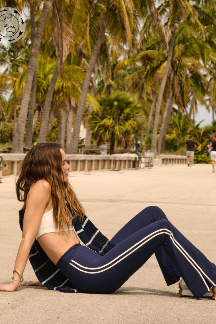 Florence Flare Pant - Navy, by The Upside

Fitness reimagined with a high-fashion feel, say hi to our Florence Flare.

High rise full length flare pant
'V' waistband detail
Cream stripe down side seam with split
Recycled soft peached with a brushed hand feel
Printed arrow logo at back waistband
Breathable, moisture wicking fabrication
Please refer to studio images for accurate colour of garment