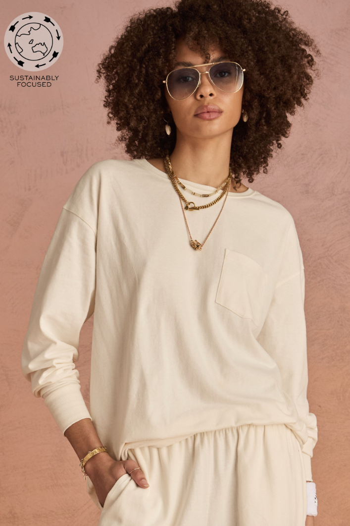 Soho Cara Long Sleeve Top - Creme, by The Upside

An effortless staple, cut for comfort and style

Long sleeve top in soft brushed recycled cotton
Relaxed silhouette shape in washed cream
Ribbed neck and cuffs
Patch pocket at front
Embroidered arrow logo at back
Please refer to studio images for accurate colour of garment